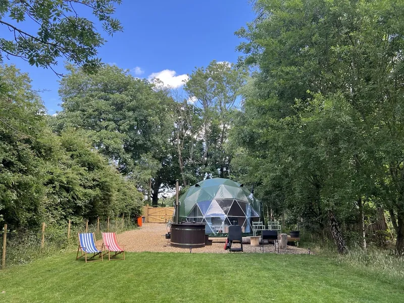Cherry Tree glamping dome and hot tub in its Kent garden setting